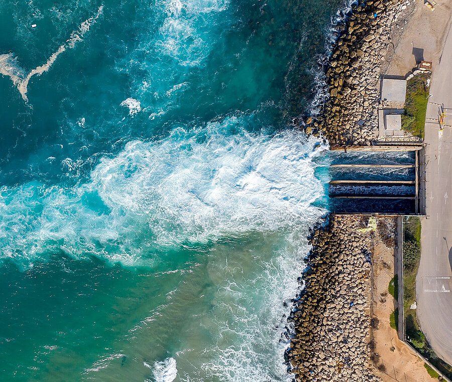 Water flowing out of a water gate into the sea