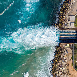 Water flowing out of a water gate into the sea